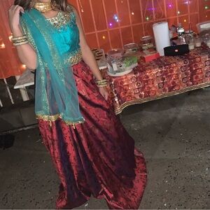 Elegant Teal and Burgundy Lehenga with Gold Accents